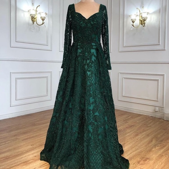 long sleeve emerald green prom dress Tulle V Neck Sleeves Dresses seamlessly flowing into the signature mermaid silhouette that hugs the curves before flaring dramatically at the knee Off Shoulder Long Sleeves Emerald